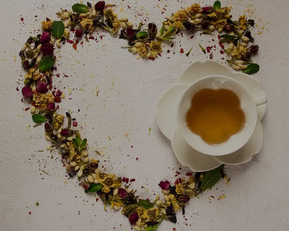 Cup of tea with a heart made of roses